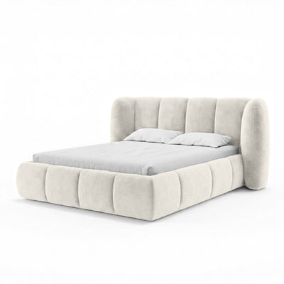 Upholstered bed with vertical tufting and storage in a soft modern style | Ventara