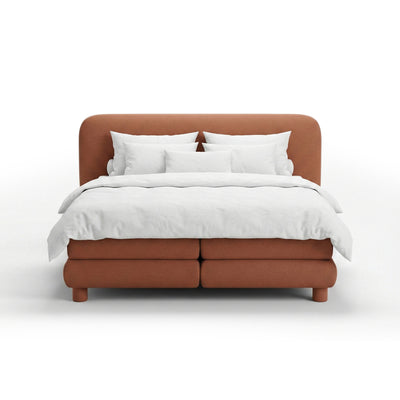 Continental bed with a rounded headboard in a modern organic style | Portela