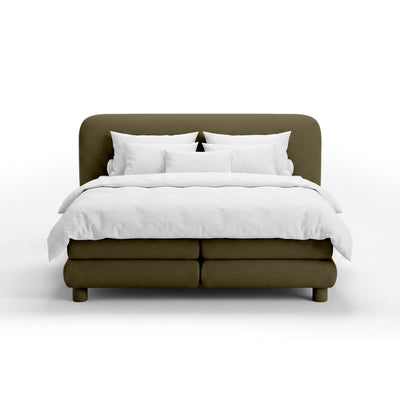Continental bed with a rounded headboard in a modern organic style | Portela