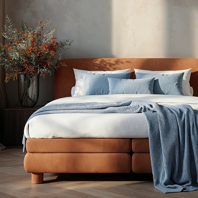 Continental bed with a rounded headboard in a modern organic style | Portela