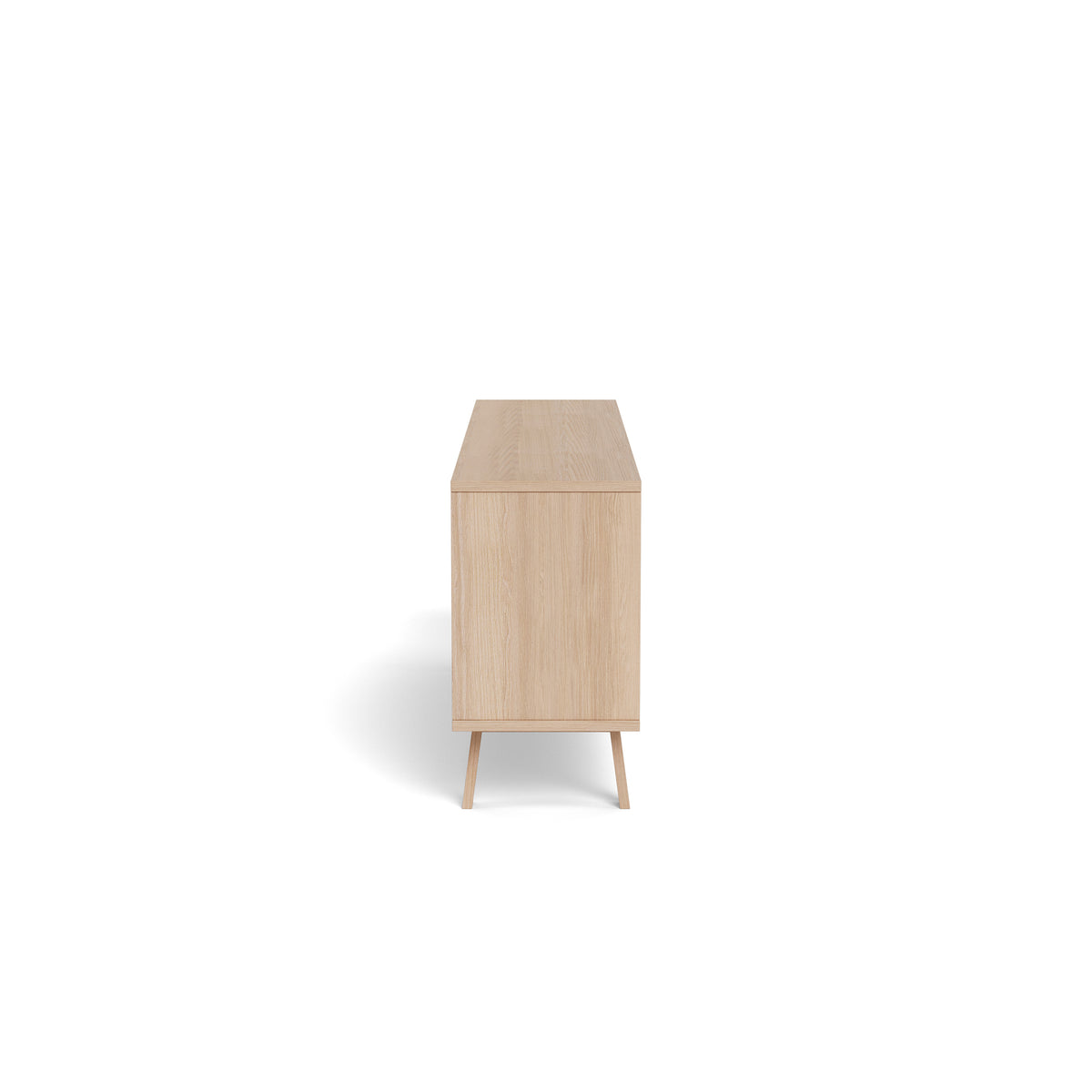 Lurisse chest of drawers, 200x75, bleached oak – side view showing the depth of the unit and the slightly slanted oak legs