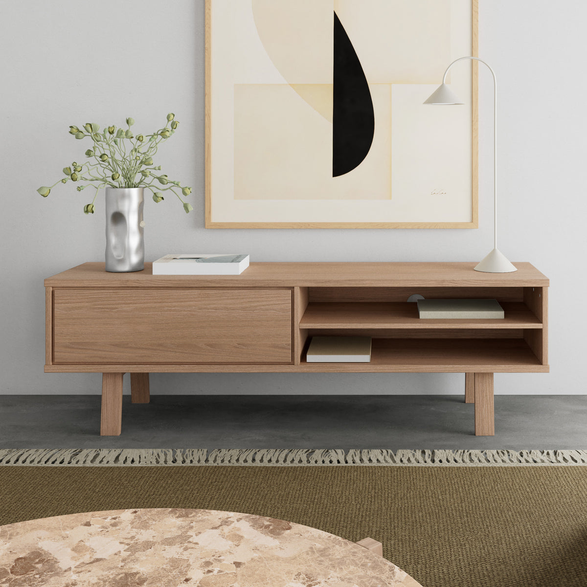 Lurisse TV cabinet, 160x50, bleached oak (as shown in the image), with a lamp and a vase, in front of a marble coffee table in the living room